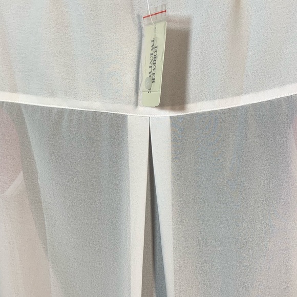 White sleeveless ruffle front blouse - Picture 8 of 8